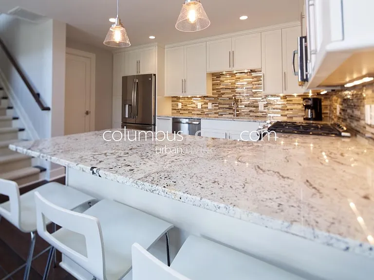 kitchen including peninsula breakfast bar