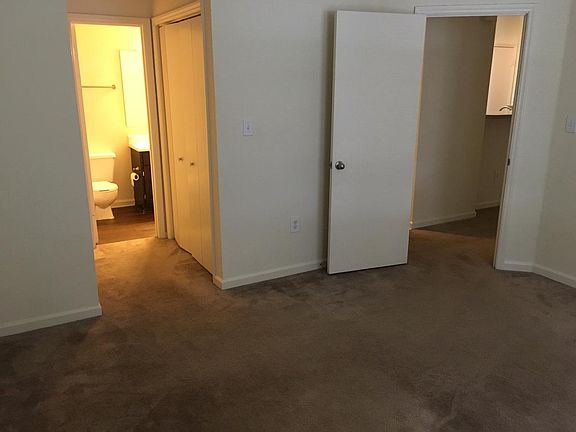 Bedroom, Door to Bathroom on Left, Living Room on Right