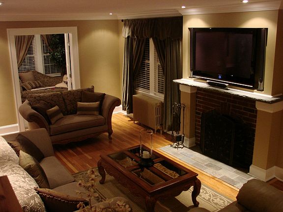 living room w/ one of the plasma tv's