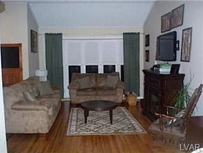 living room with cathedral ceiling