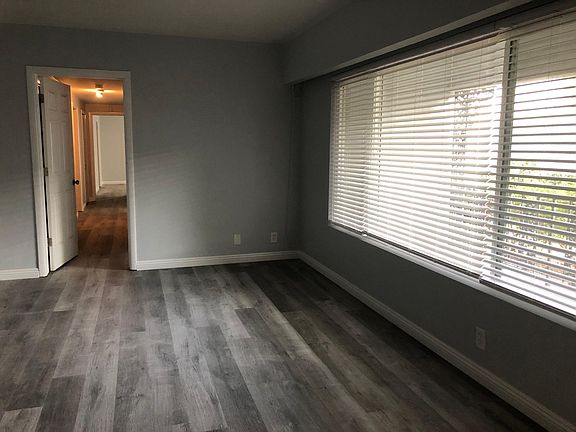 Living room with hallway that leads to bedrooms.