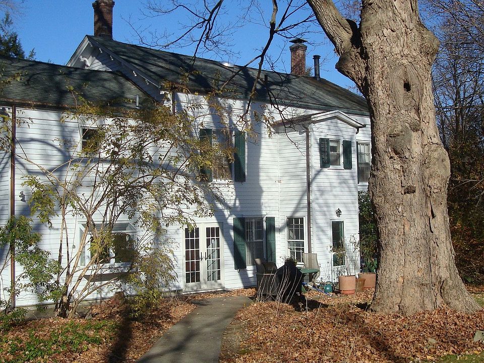 Back path from driveway to terrace past majestic oak