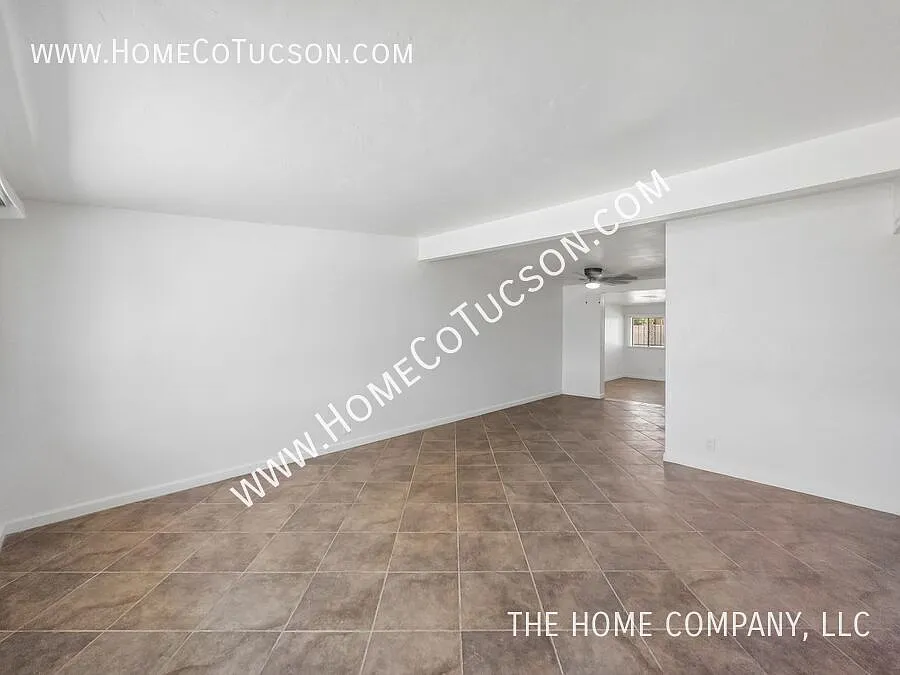 Spacious 5-Bedroom Brick Home with Large Fenced Yard | 6150 E 32nd St — Photo 3