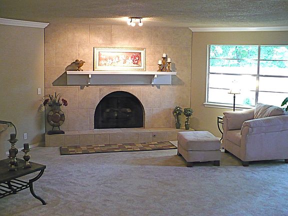 Dramatic tile fireplace with remote controlled / accent lighting in large LR 