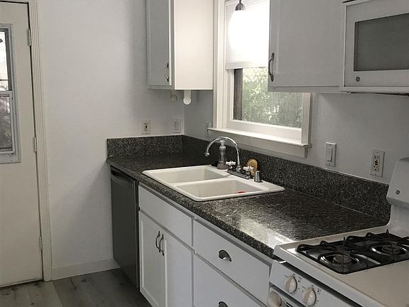 kitchen with dishwasher and microwave