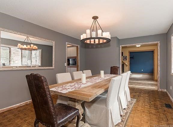 Antique finishes on the trim of the window, doorway and wall gives the room a more sophisticated look.