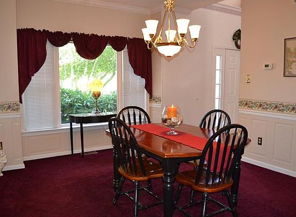 Formal Dining Room w/ Wainscoting; Picture Window
