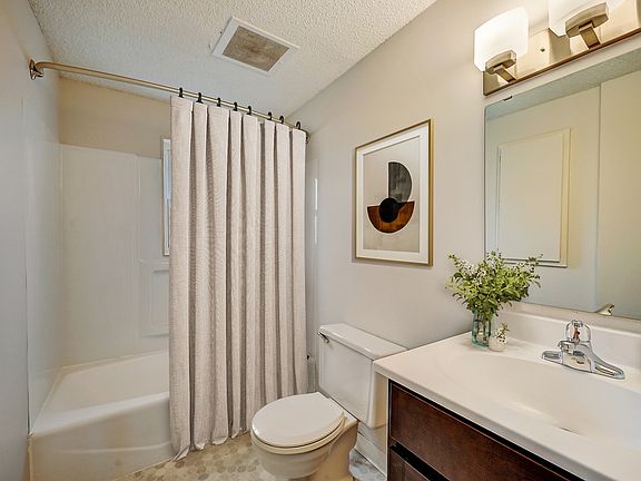 Recently Renovated Townhouse Style Apartments featuring New gray carpet, Neutral paint scheme, Premium hardwood-style flooring, Neutral paint scheme, Upgraded light fixtures, New cabinets, Matching stainless steel appliances, Washer/Dryer, Air conditionin