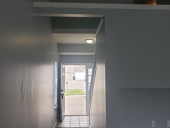 View of front door from living room