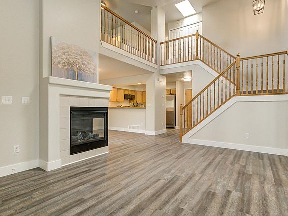 Living Room w/ Vaulted Ceilings and Gas Fireplace