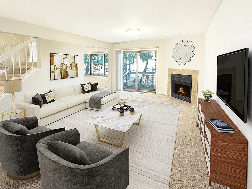 Sumptuous living area with doorwall to patio, fireplace, large formal dining room.