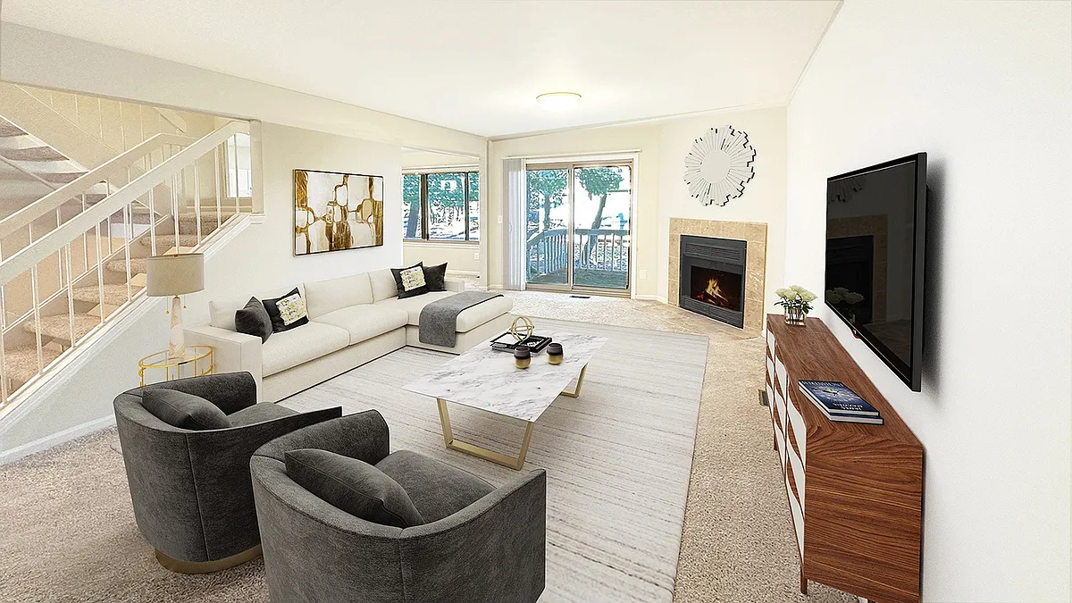 Sumptuous living area with doorwall to patio, fireplace, large formal dining room. - Weatherstone Townhomes