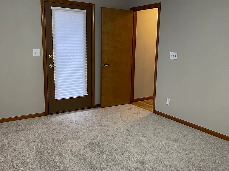 Main bedroom with door that goes out to patio.