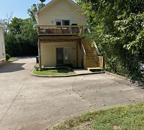 Duplex from the rear, parking spaces in the foreground.