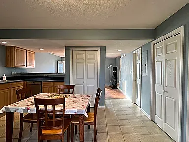 Kitchen with a side view of half bath on downstairs level