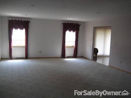 Great Room
						:
						View toward back of house, arch to kitchen eat-in area