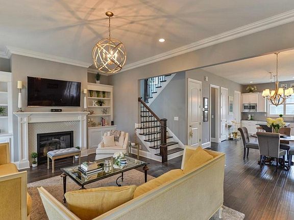 Built in display cases, upgraded lighting package and natural hardwood floors grace the home