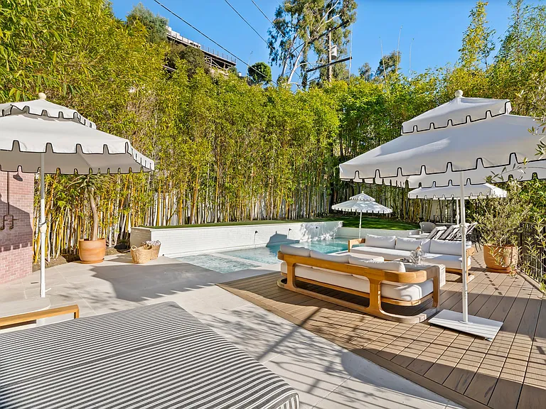 Bask in the sun or cool off in the pool_this outdoor space has it all.