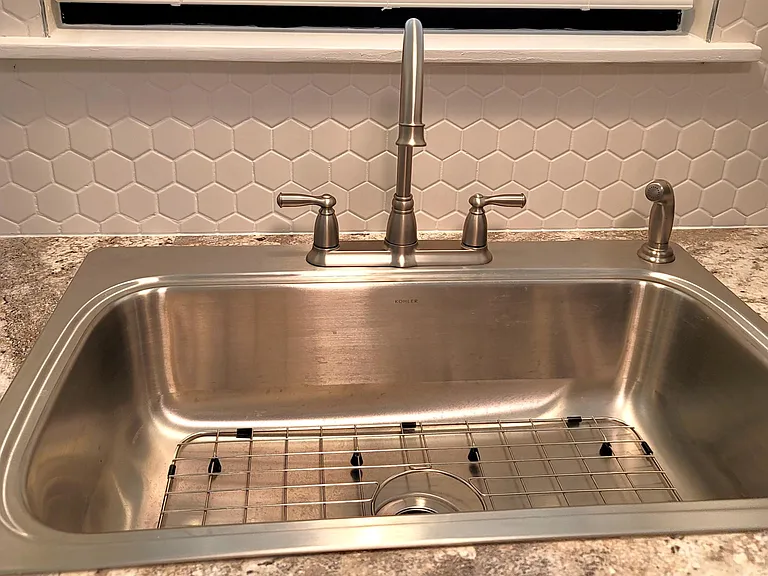 New deep stainless steele sink with new fixtures.