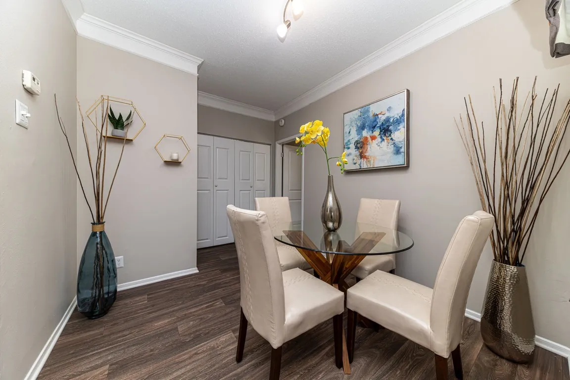 Dining area with hardwood-style flooring