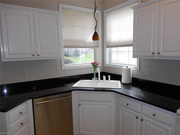 Look out over the golf course while washing dishes.