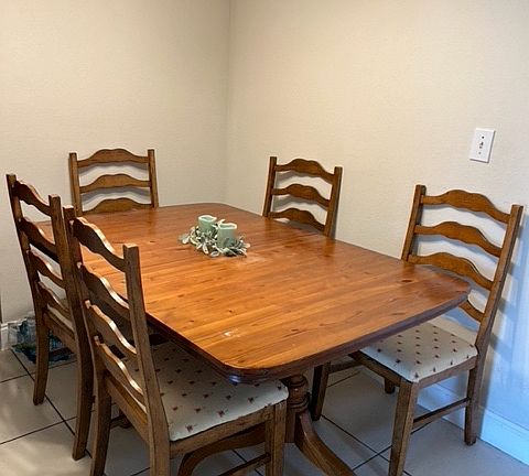 furnished with dining table and chairs
