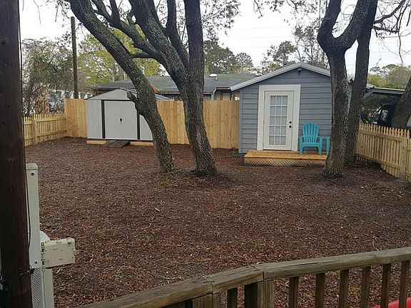 Fenced rear yard with two st