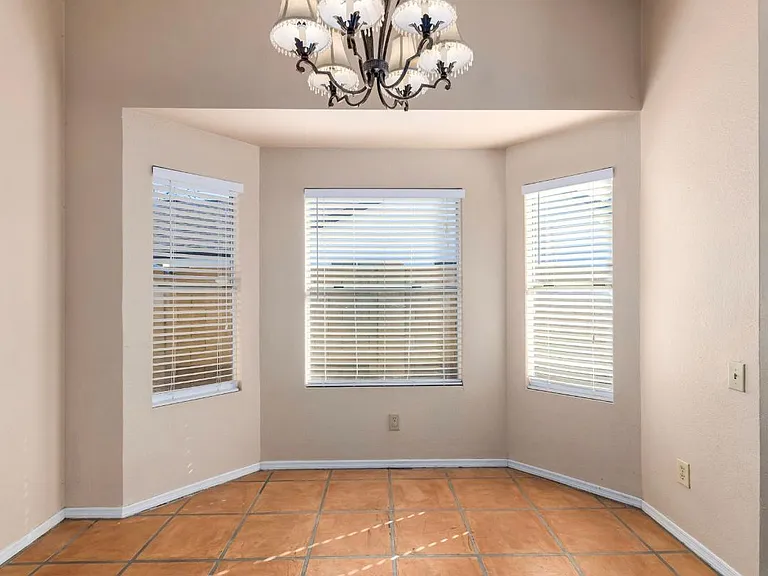 Kitchen table nook, nice and light with big windows!