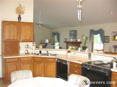 Kitchen looks into Living and dining room