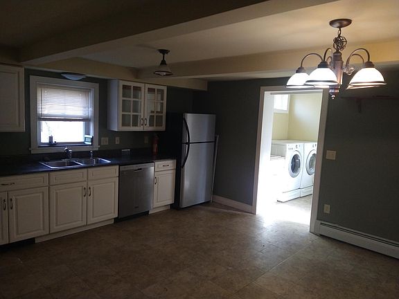Eat-in kitchen with dishwasher and mudroom with washer and dryer