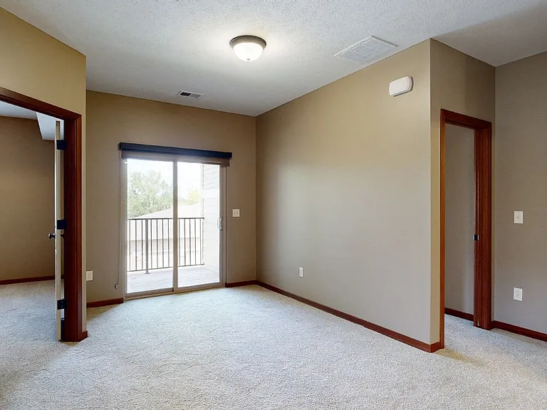 Privacy meets luxury with roller shades on every sliding glass door.