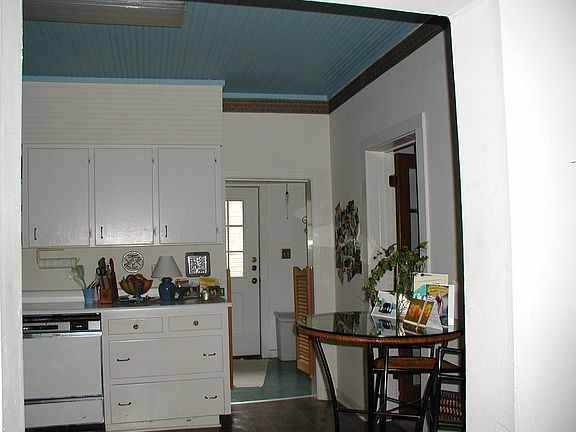 Kitchen through to utility room with washer/dryer