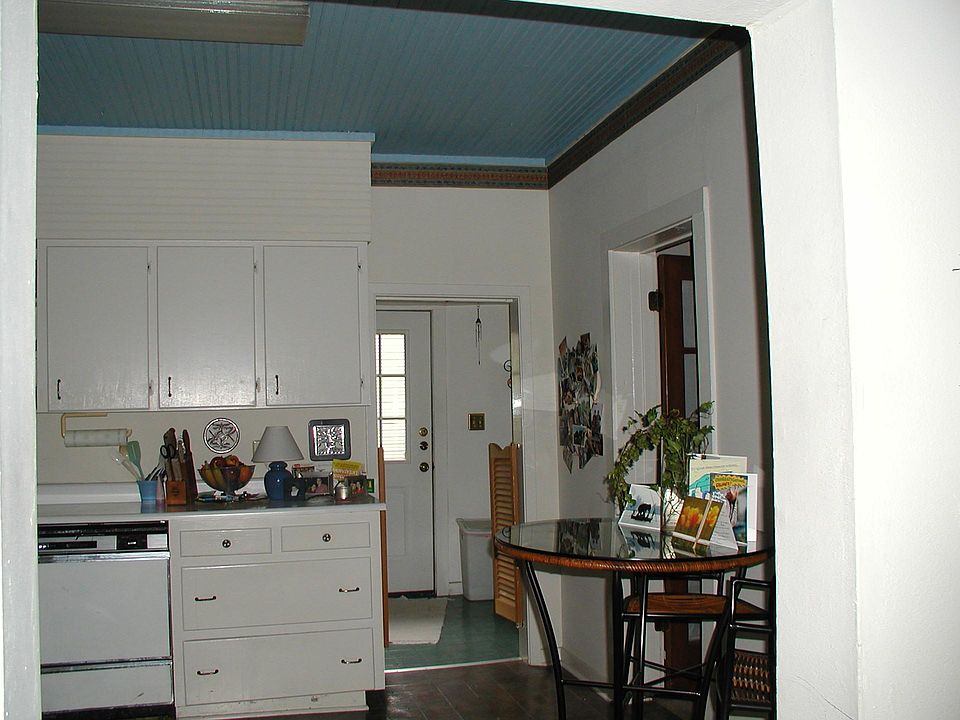 Kitchen through to utility room with washer/dryer