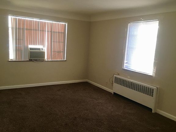 Living room area with coat closet