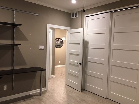 Welcome to the bedroom .. Another new wood core shaker door and sliding closet doors to match! Wide crown molding continues into the bedroom