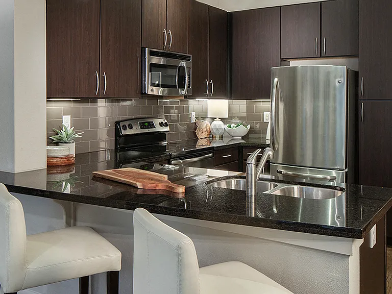 Chef's kitchen featuring GE® stainless steel appliances