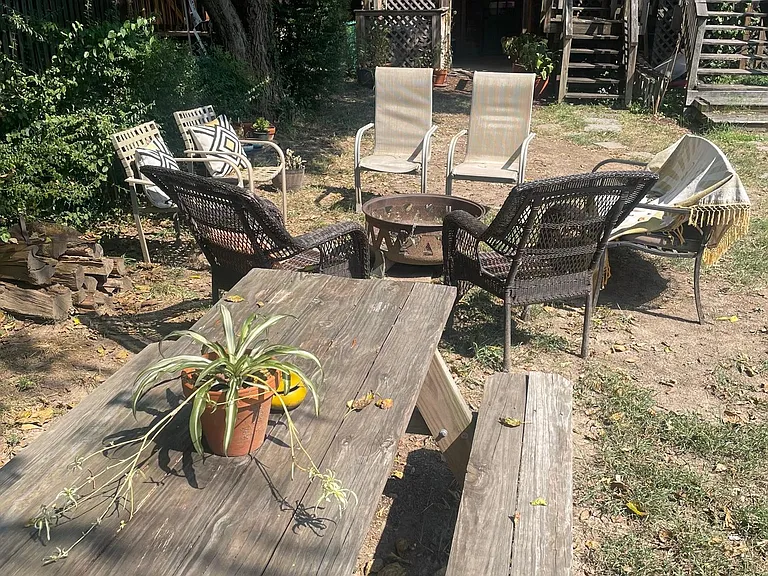 Backyard picnic table and firepit.