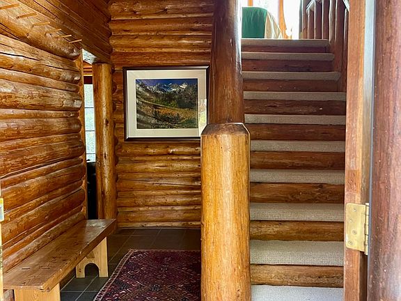 Entryway with staircase to Upper Turret bedroom