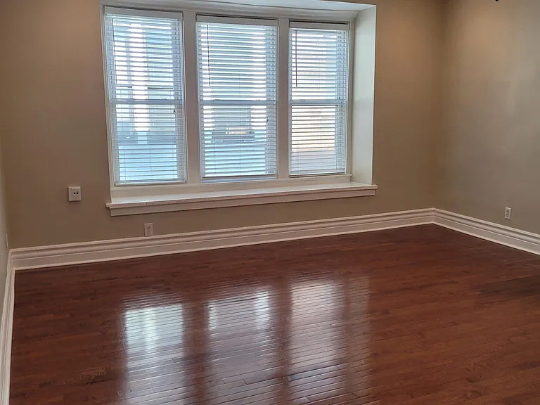 Spacious living room with hardwood floor