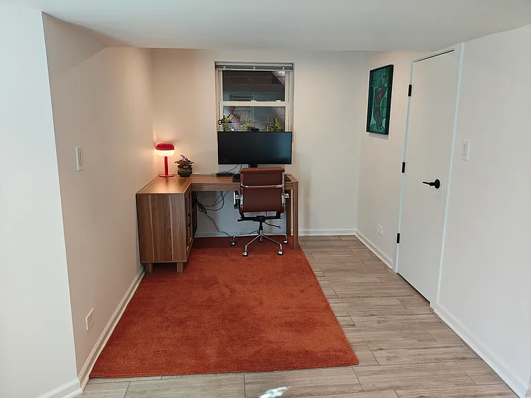 There is an office nook / den area. The door to the right is a coat closet.