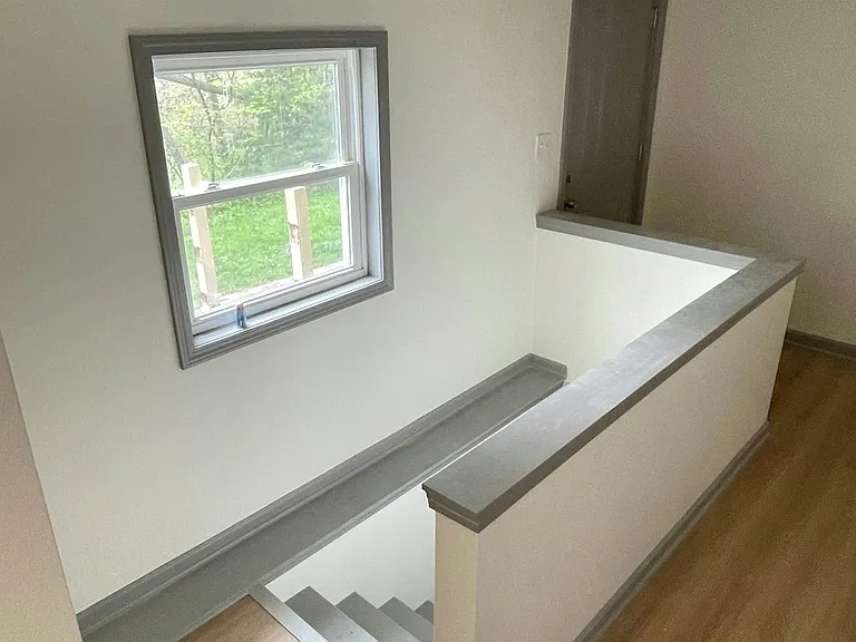 Hall and Stairs to basement/garage