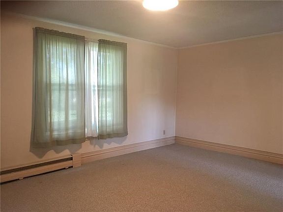 DINING ROOM or possibly another living area.  To the right off the front entry.  This room has plenty of windows for natural sun