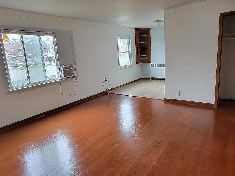 Front entrance door into living room + kitchen.