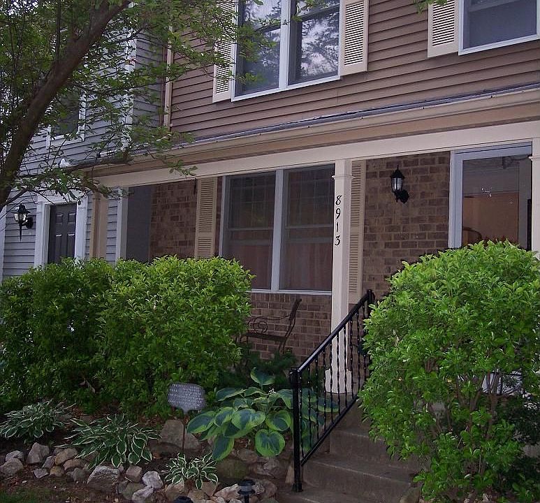 Front with porch, new lighting, 2 designated parking