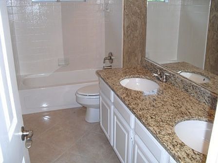Hall bath with Granite tops and new brushed nickel fixtures