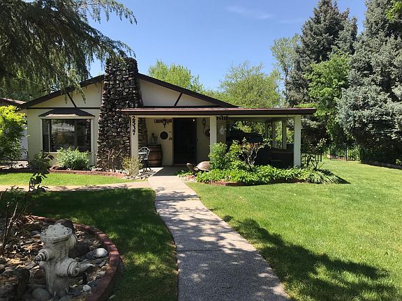 The front of the home, which is in a flat quiet neighborhood.