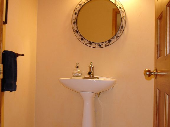 downstairs bath with white marble floors
