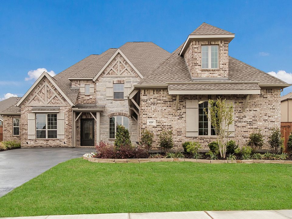 Curb appeal galore with the stone and brick exterior