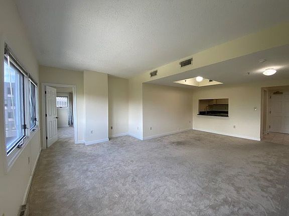 Living room and dining room with a breakfast bar.