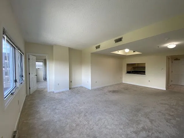 Living room and dining room with a breakfast bar.